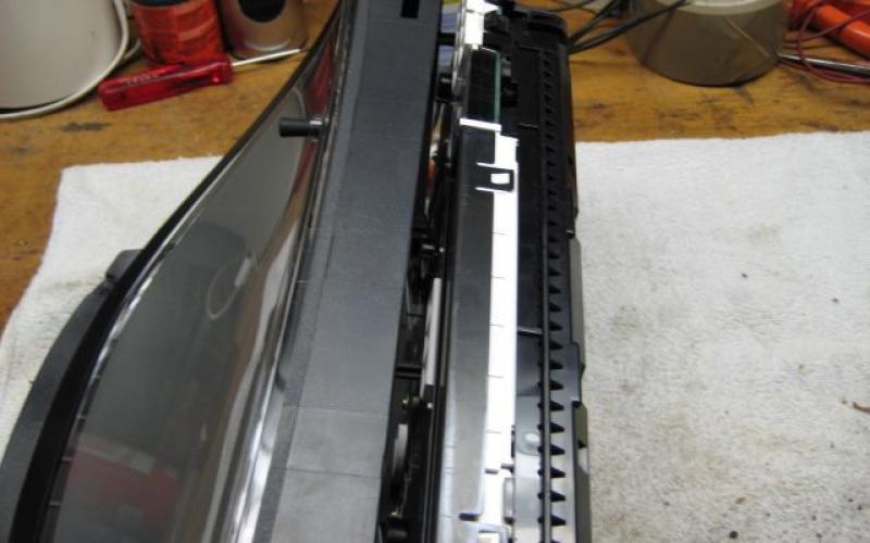 Then press in the tabs (2 top 2 bottom) and slide the front off